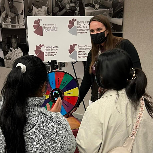  A principal talks with students about academies and pathways